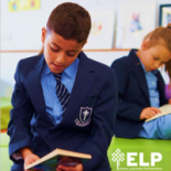 School child reading book